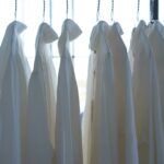 white dress shirt hangign on clothes